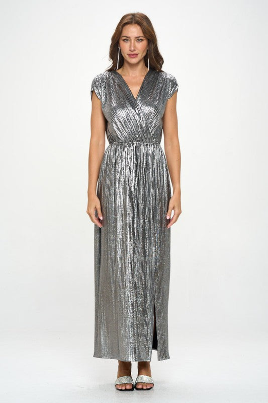 Shiny silver sleeveless dress featuring a side slit and metallic fabric.
