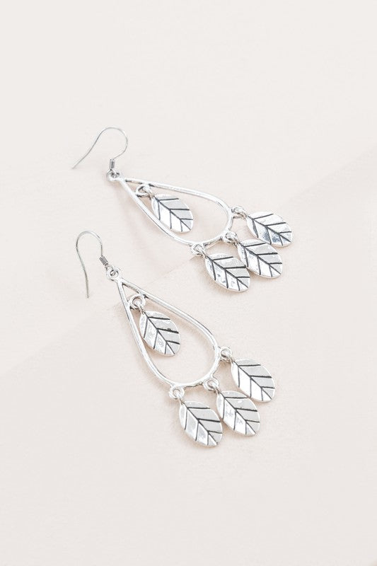 Lightweight silver hook earrings featuring delicate leaf charms for casual and elegant wear.
