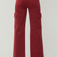 Back view of RISEN High Rise Wide Leg Cargo Jeans in a bold red color featuring stylish cargo pockets.
