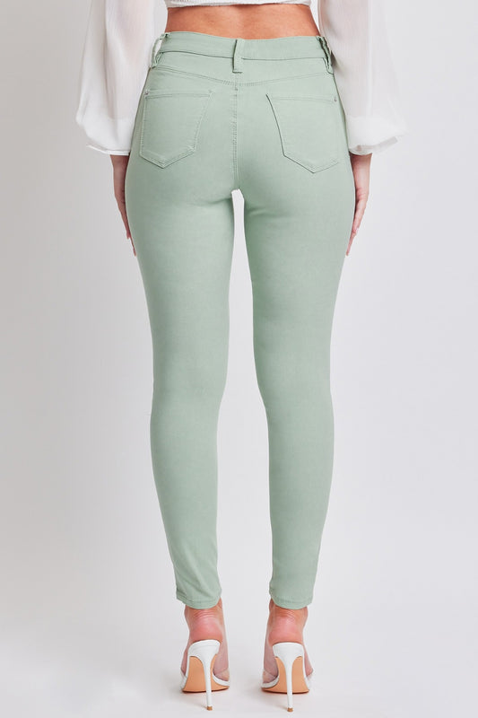 Sage green skinny jeans for women’s fashion-forward looks.