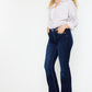 Slim flare jeans styled with a classic blouse for a polished look.
