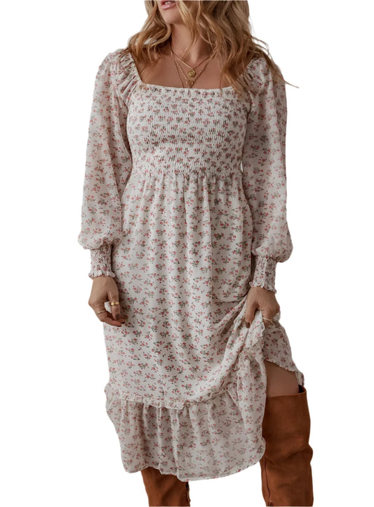 Front view of smocked floral square neck midi dress with long sleeves and ruffle hem.
