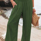 Women's green wide leg pants with a comfortable smocked waistband
