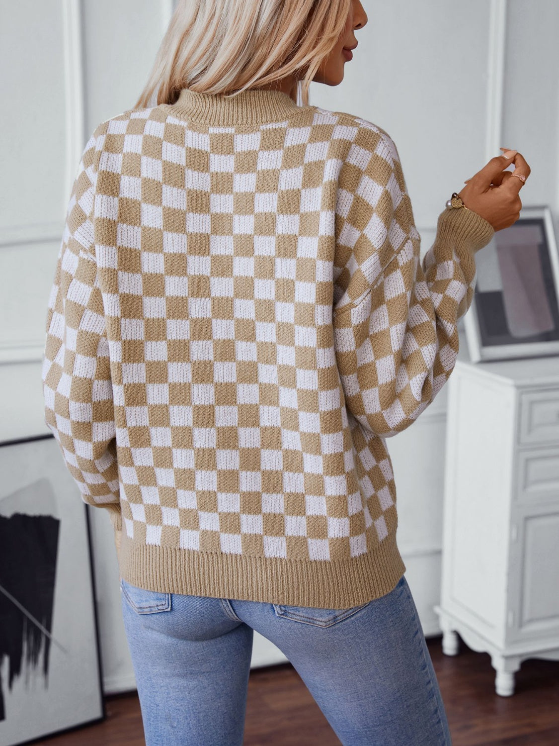 Soft camel checkerboard sweater with a classic V-neckline.
