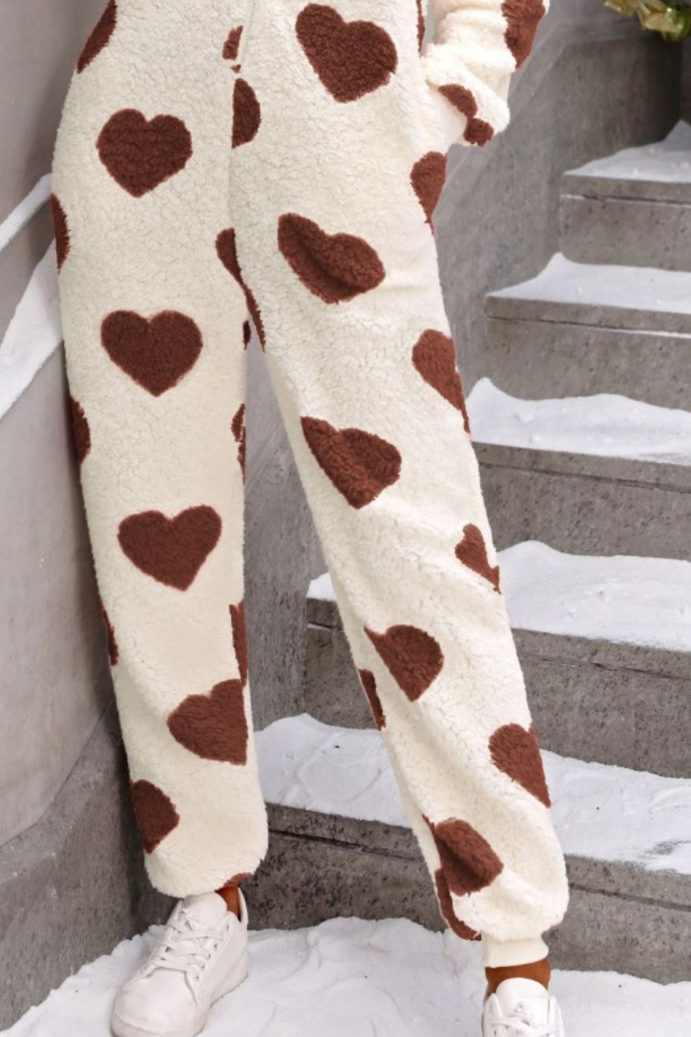 Women’s winter onesie with oversized heart print and hood