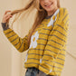 Whimsical yellow sweater with white flower pattern and cozy, relaxed fit | boho aesthetic
