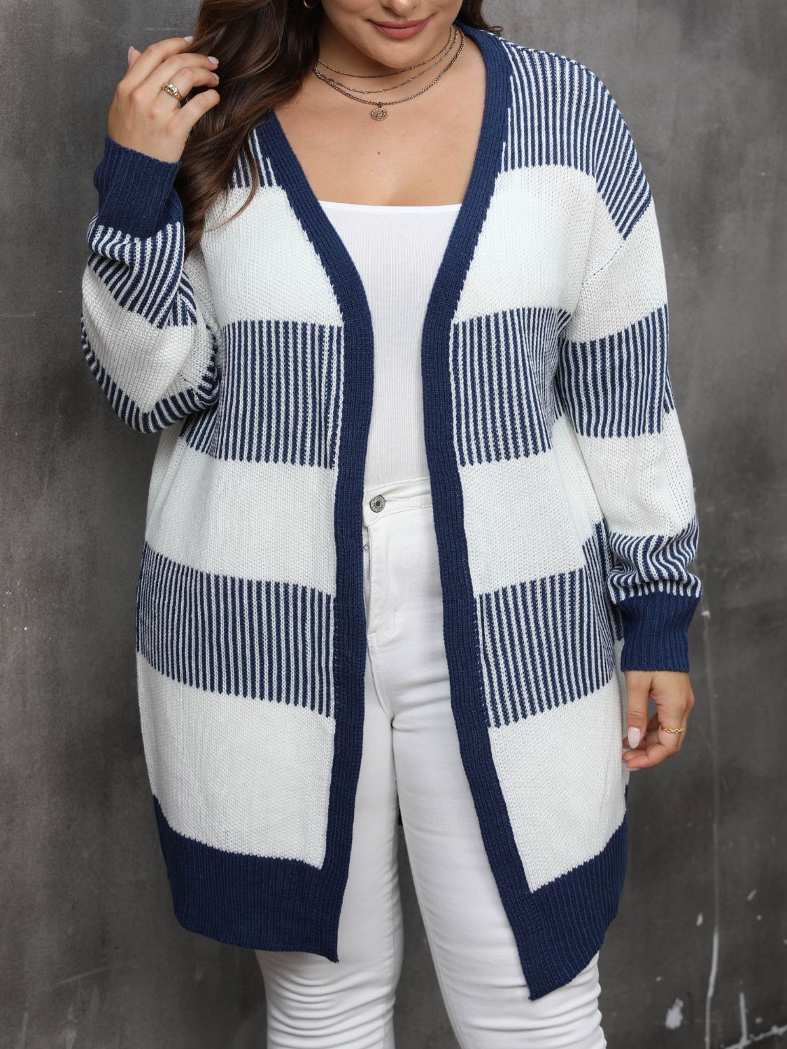 Long open-front plus-size cardigan with bold navy and white stripes.
