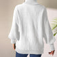 Soft knit white turtleneck sweater with batwing sleeves