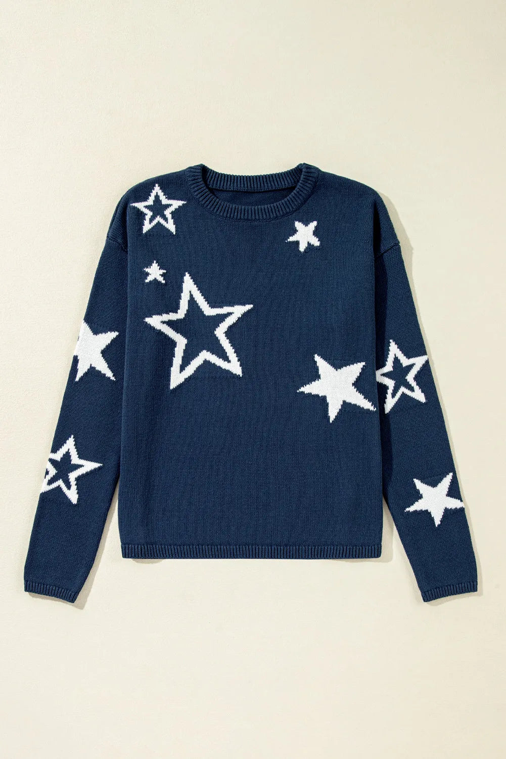 Soft navy sweater with white star print, made from 100% cotton for breathable comfort.

