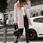 Full-length image of a light pink overcoat perfect for autumn styling.
