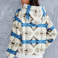 Women's fleece hoodie featuring a geometric print and a half-zip for easy layering.