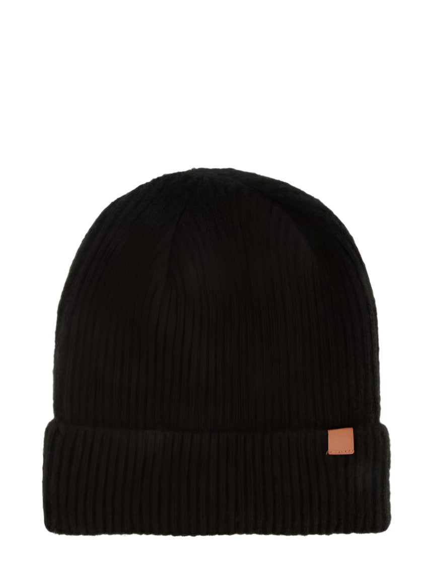 A solid ribbed beanie in black with a leather tab, perfect for winter.
