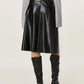 Elegant black leather skirt with high waist and timeless silhouette.
