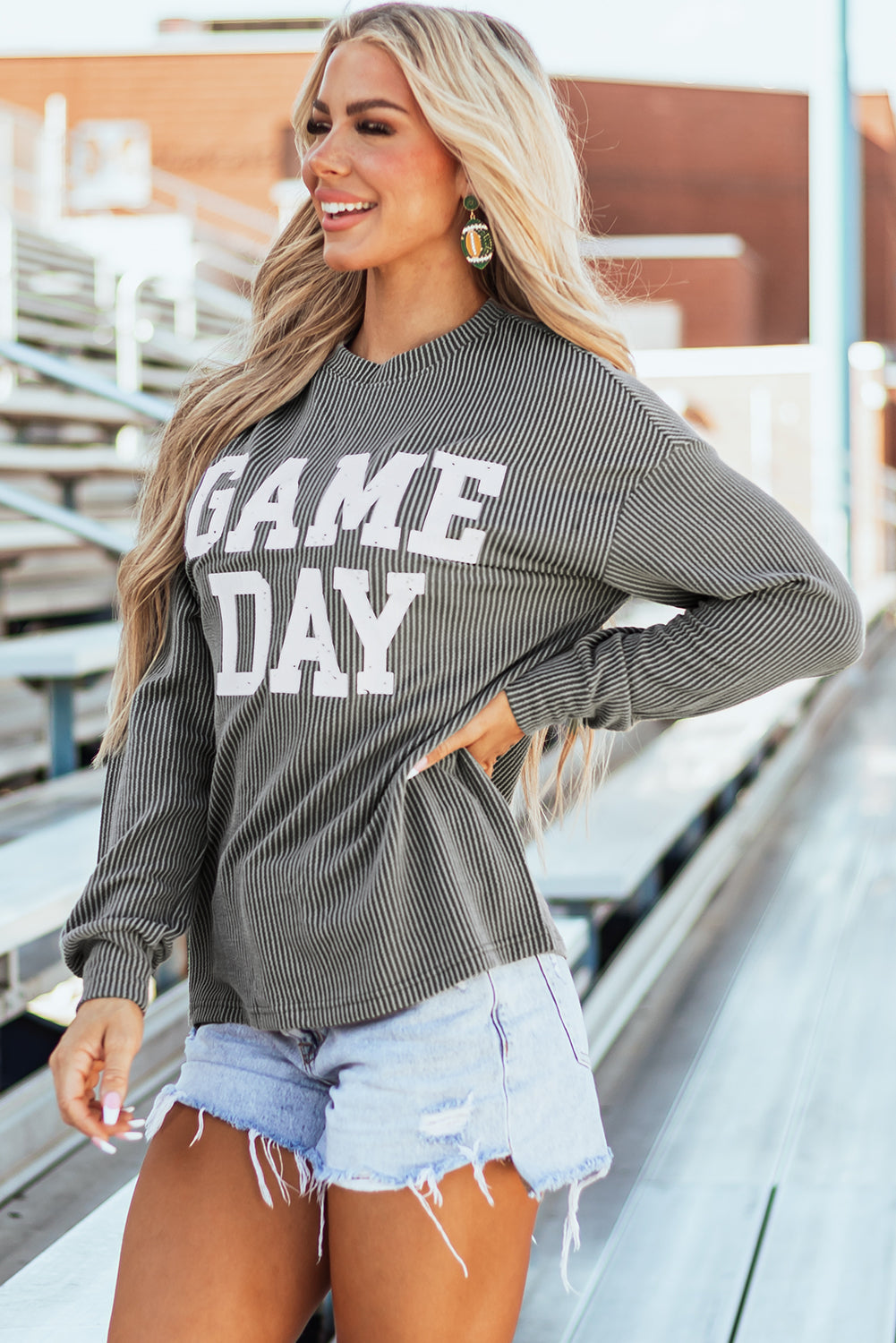 Comfy and stylish women's game day sweatshirt with bold white "Game Day" graphic.