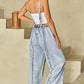 Retro-inspired denim overalls with a wide-leg silhouette for women.
