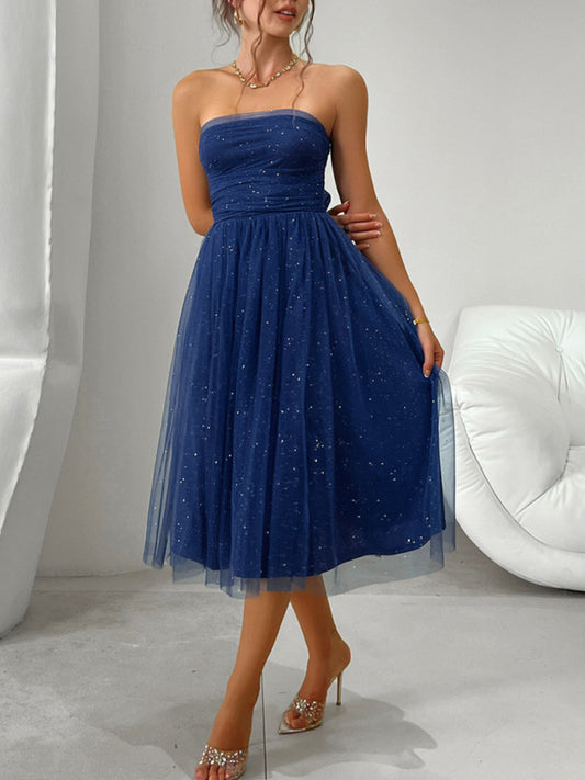 Strapless navy tea-length dress with a high waist and timeless design.