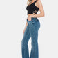 Vintage wash flare jeans featuring a modern cut hem detail.
