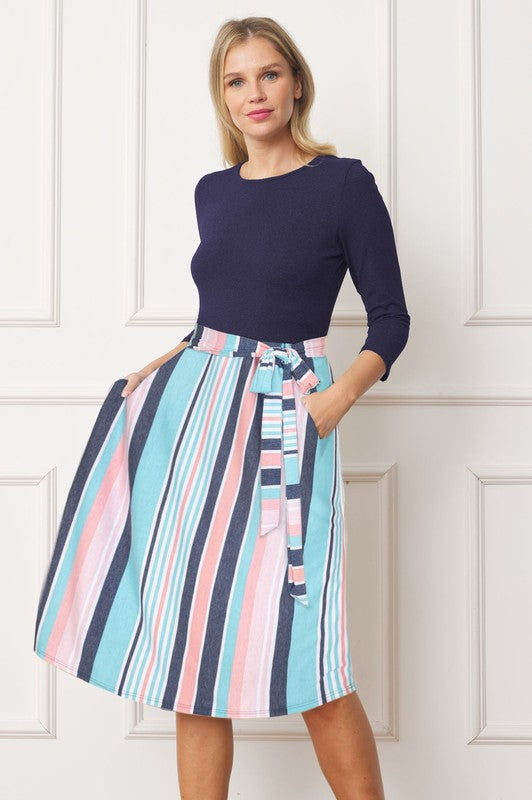 Front view of navy striped tie-waist midi dress with 3/4 sleeves
