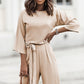 Stylish apricot jumpsuit paired with heels for an evening look.
