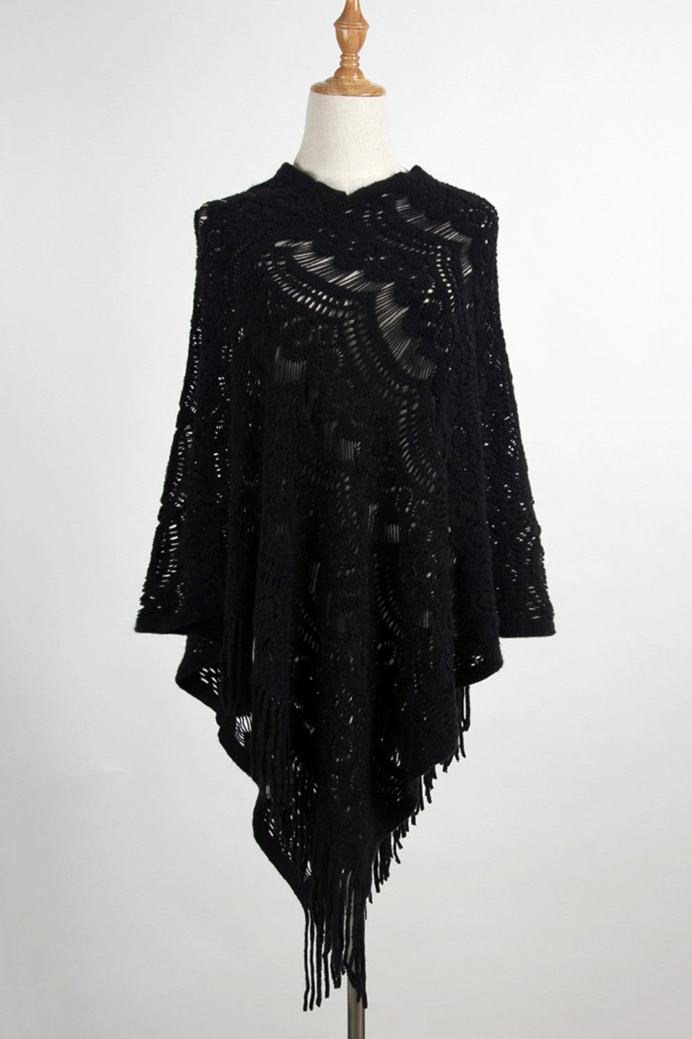 Black fashion poncho with relaxed fit and bohemian style
