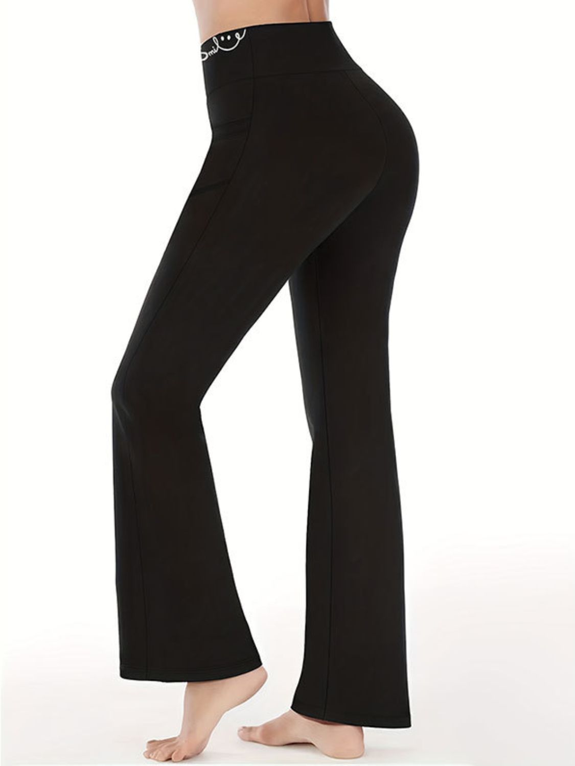 High-rise black yoga pants with a bootcut style, ideal for workouts and everyday wear.
