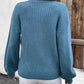 Soft blue cardigan with ribbed texture, featuring a convenient zip closure.
