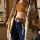 Stylish camel suede western belt with detailed antique gold buckle.
