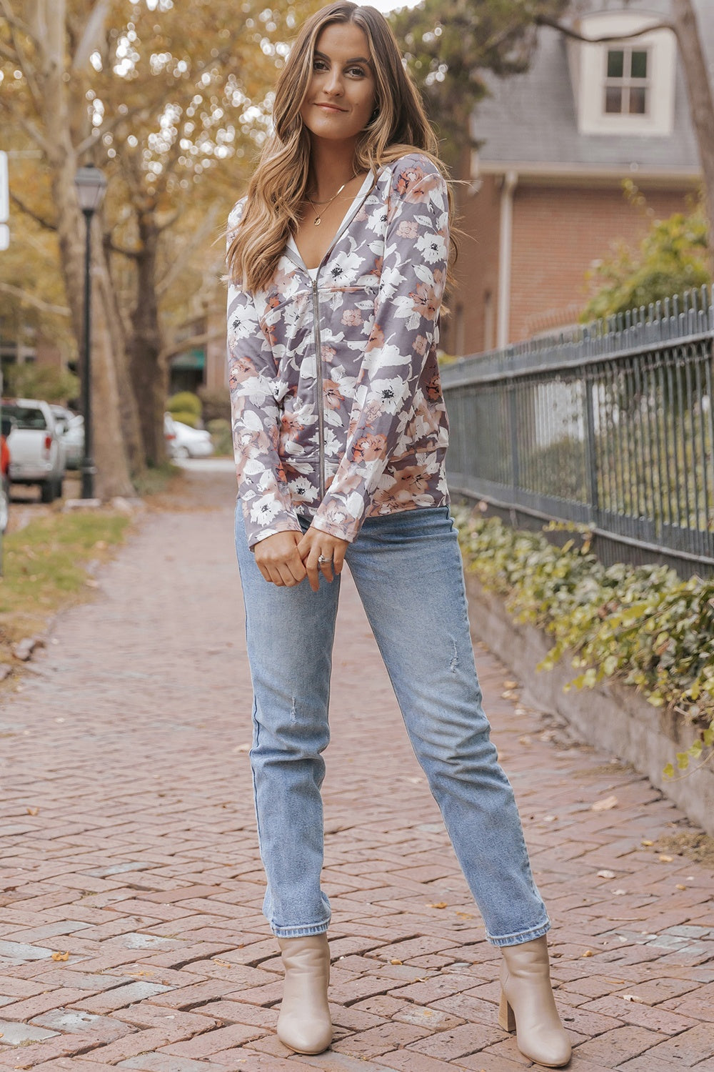 Feminine floral zip-up hoodie with pockets for a relaxed look
