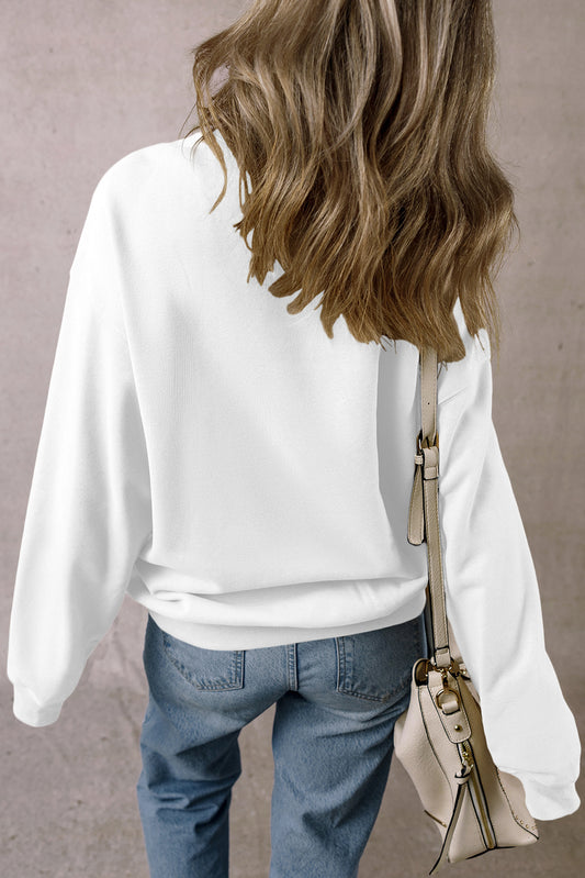 Stylish white crewneck sweatshirt with chenille football and "Game Day" text.