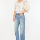 Women’s mid-rise straight jeans by Kancan with raw hem.
