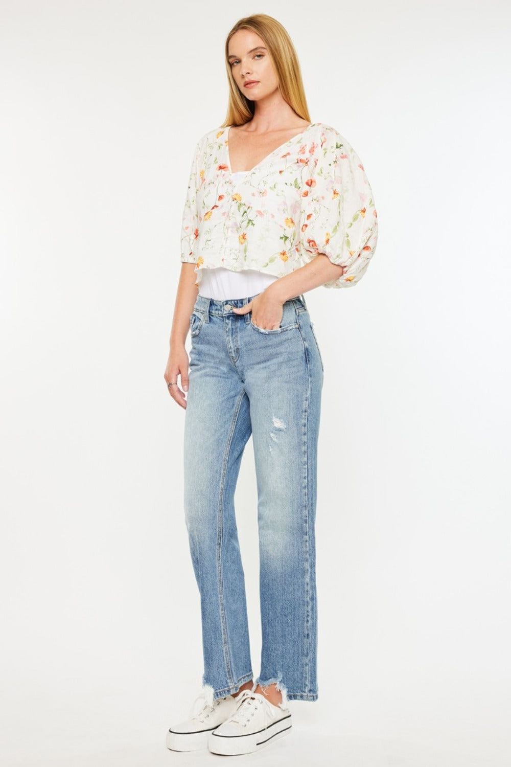 Women’s mid-rise straight jeans by Kancan with raw hem.
