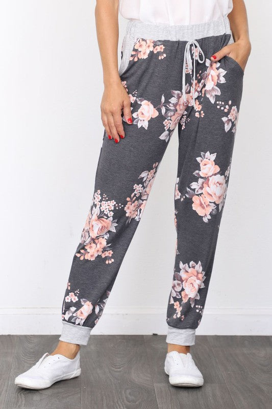 Soft gray plus size sweatpants with floral accents and drawstring waistband
