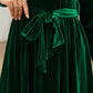 Luxurious green velvet dress with round neck
