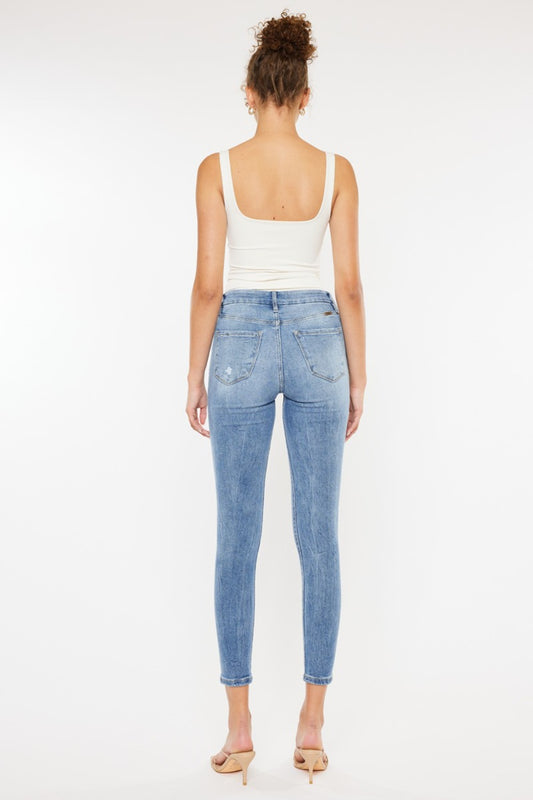 High-rise skinny jeans by Kancan in a light wash denim with stylish distressing.