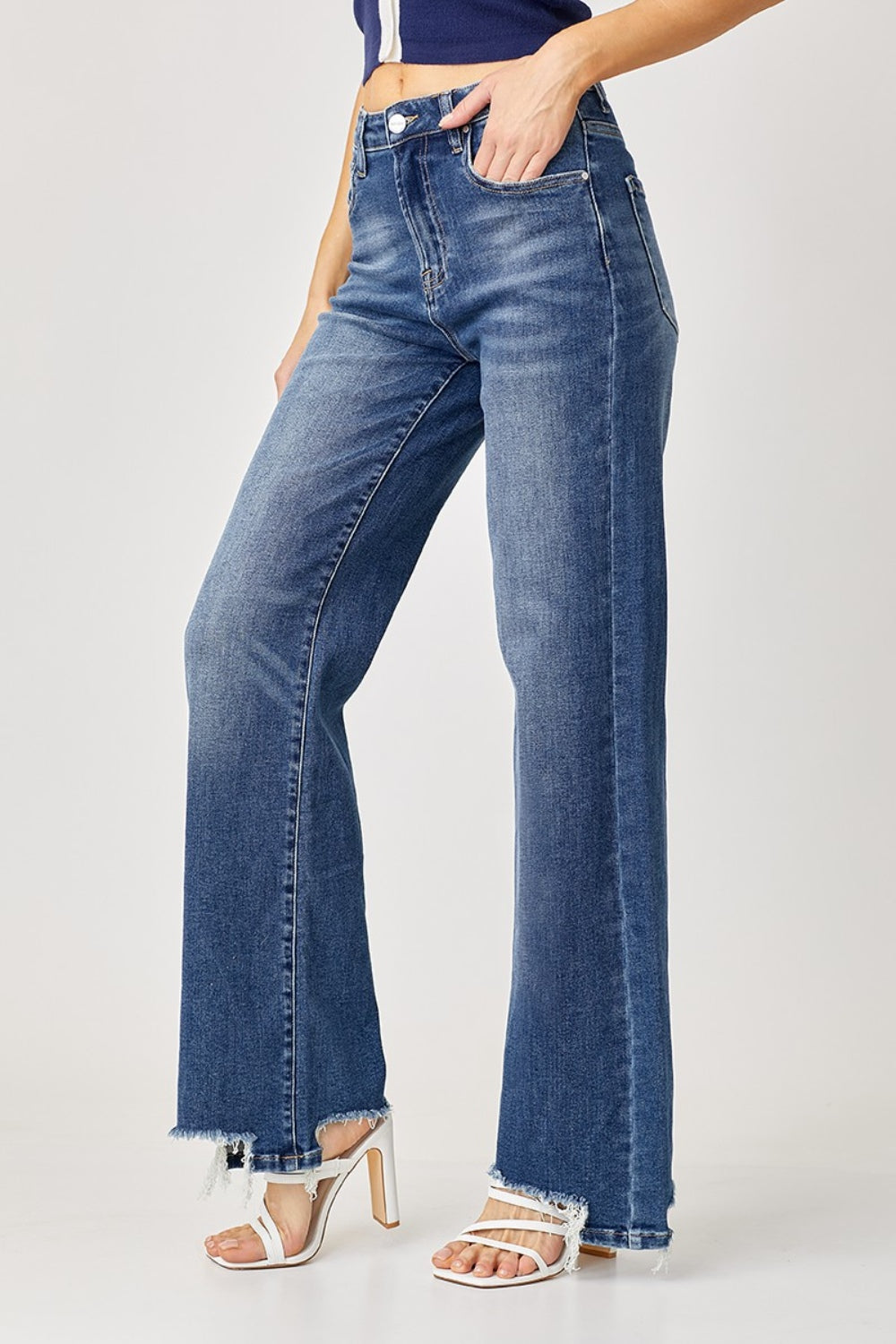 RISEN high-rise wide leg jeans featuring a frayed hem for a trendy touch
