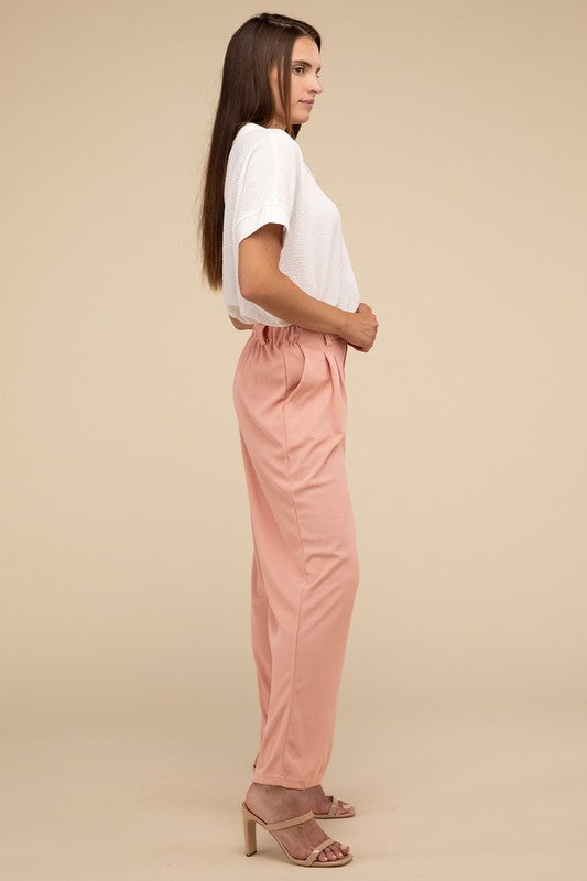 Stylish pink waffle trousers for versatile wear
