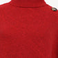 Stylish red turtleneck poncho perfect for layering.
