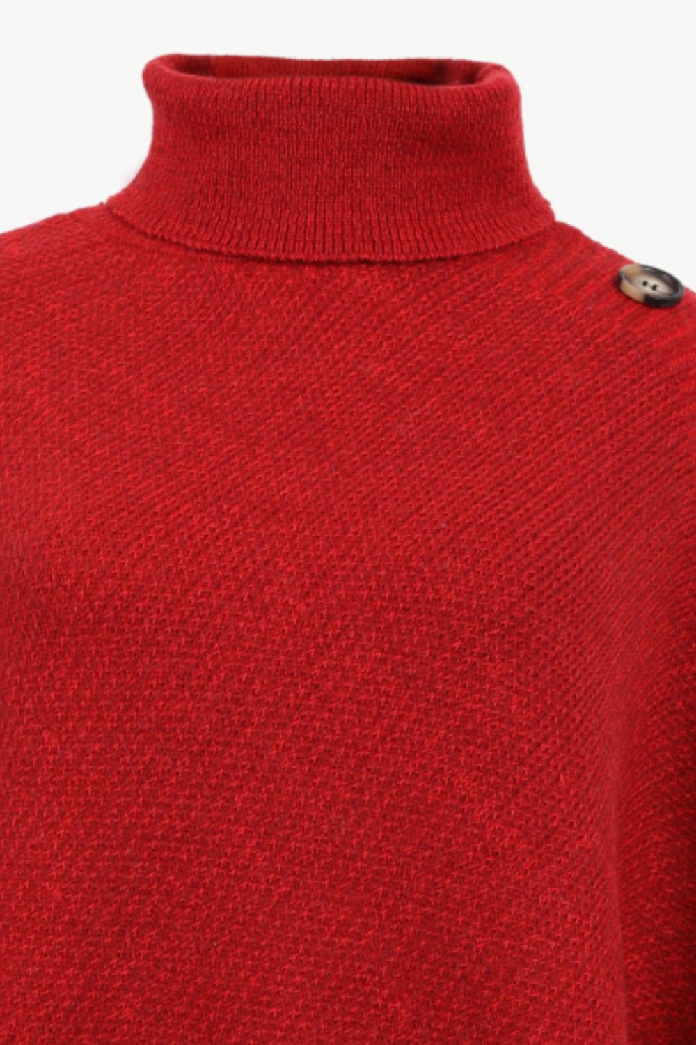 Stylish red turtleneck poncho perfect for layering.
