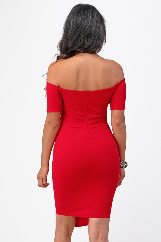 Red bodycon party dress with a twist-front detail and off-shoulder neckline.
