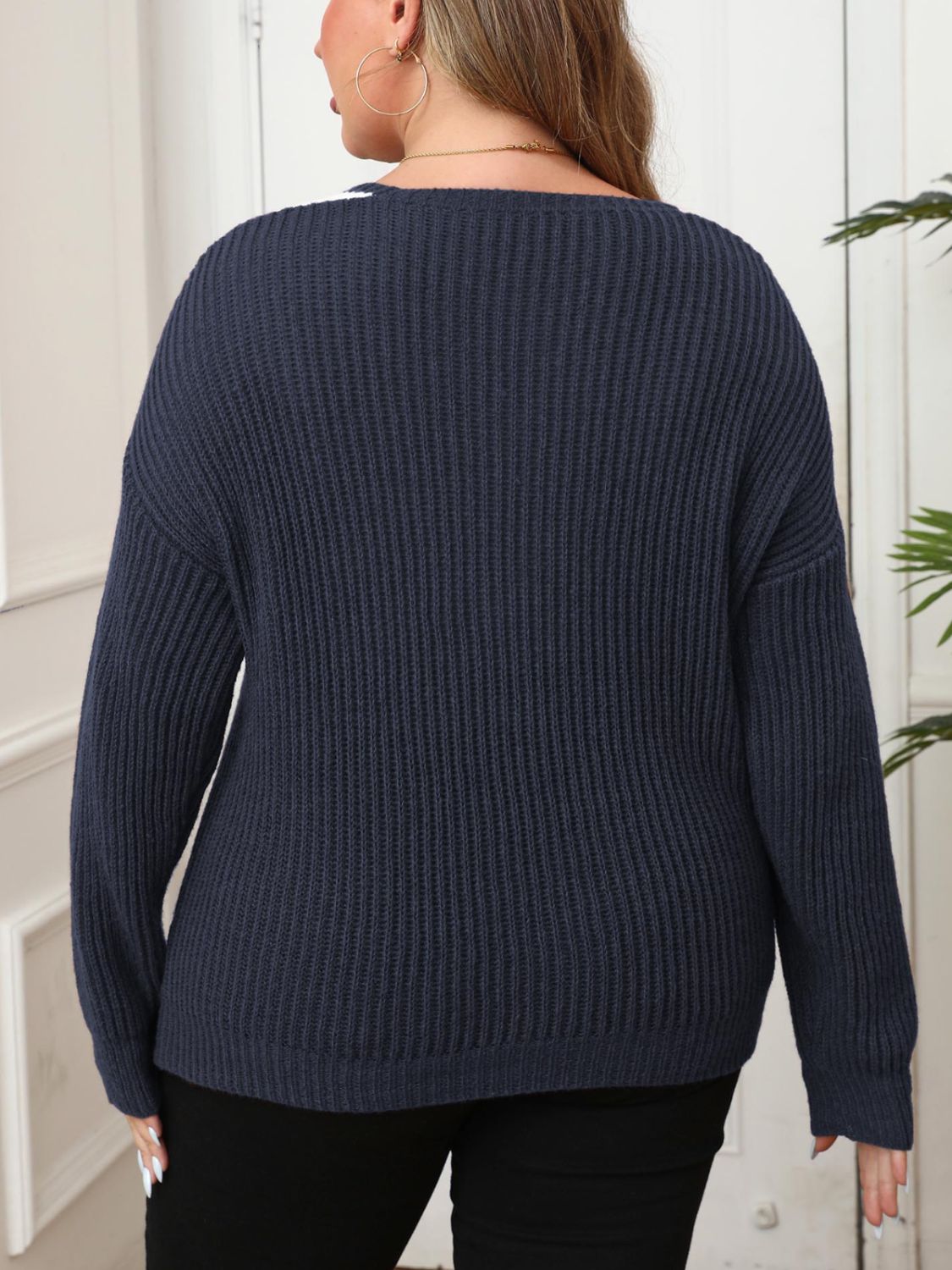 Navy plus size ribbed knit sweater featuring a flattering V-neckline