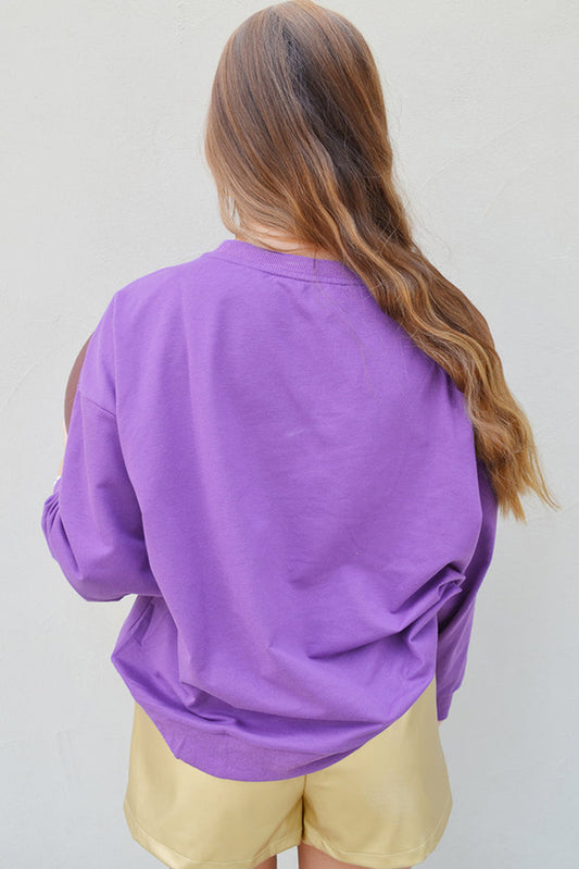 Casual game day sweatshirt in purple featuring a football graphic for a fun look.