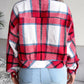 Stylish women’s plaid button-up jacket with a classic collared design.
