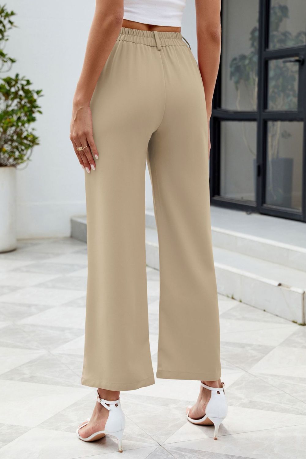 Tailored fit tan high-waisted trousers, perfect for office wear
