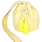 Yellow Aztec bucket bag with playful tassel details and roomy design.
