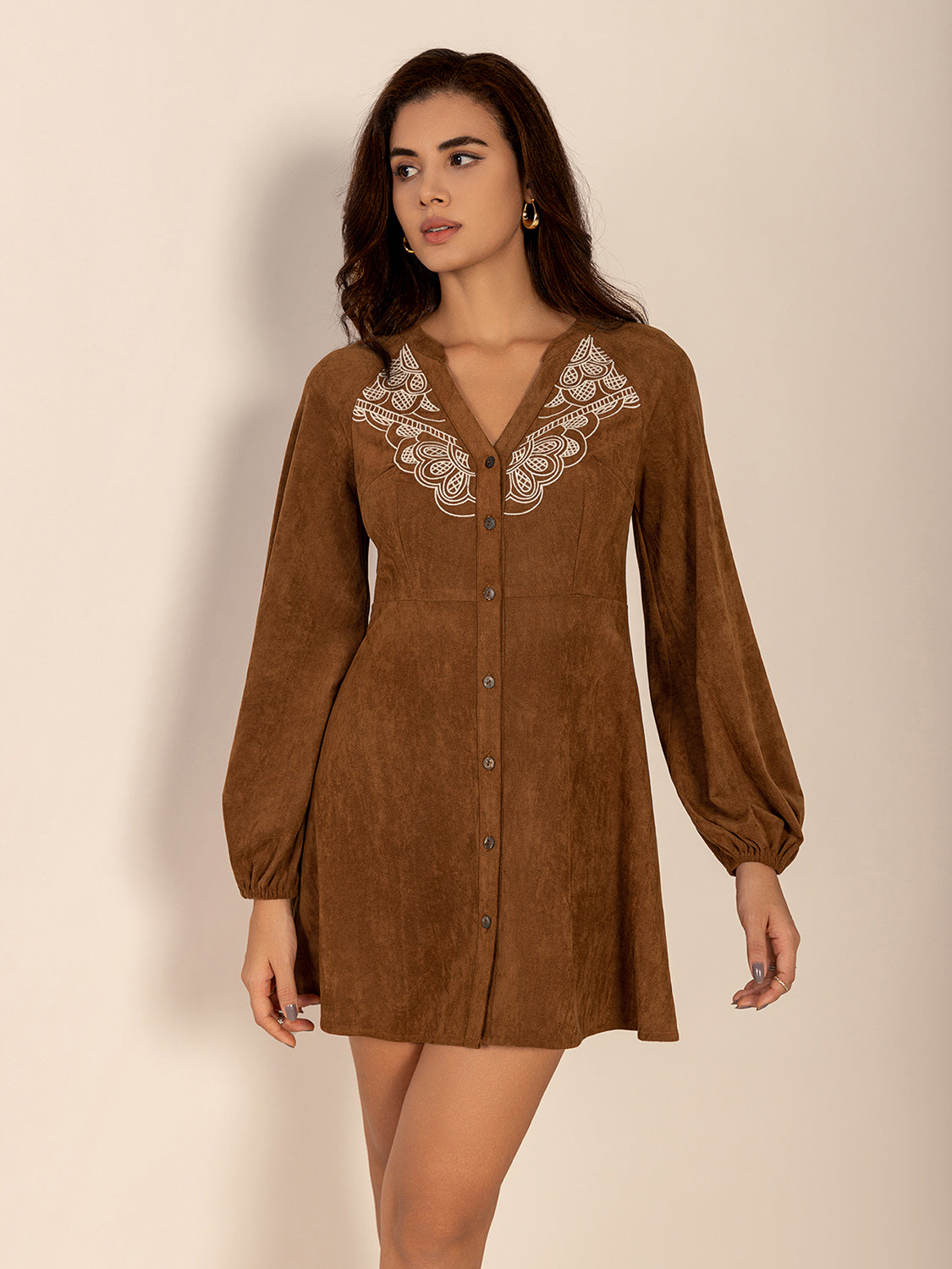 Embroidered caramel dress with suede-like fabric and buttons
