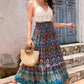 Blue bohemian maxi skirt styled for summer with a flattering flowy design.
