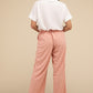 Tailored pink waffle pants with relaxed silhouette
