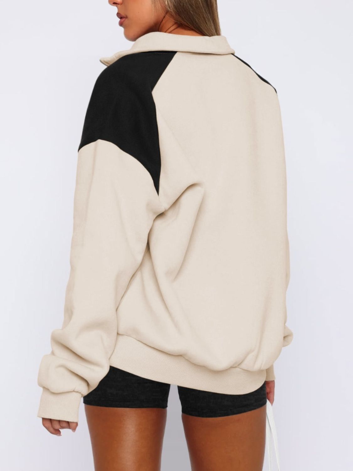 Women's tan half-zip color block sweatshirt, perfect for casual outfits.
