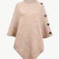 Front view of tan turtleneck buttoned poncho in ribbed knit.
