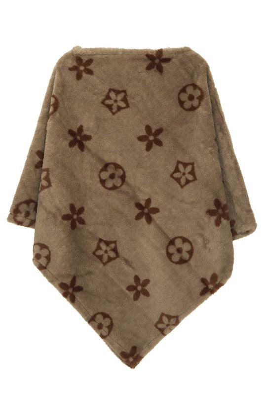 Taupe cozy poncho featuring a stylish floral pattern
